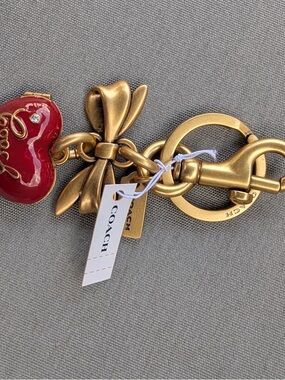 Coach Gold-Tone Bow Keychain with Red Heart Charm
